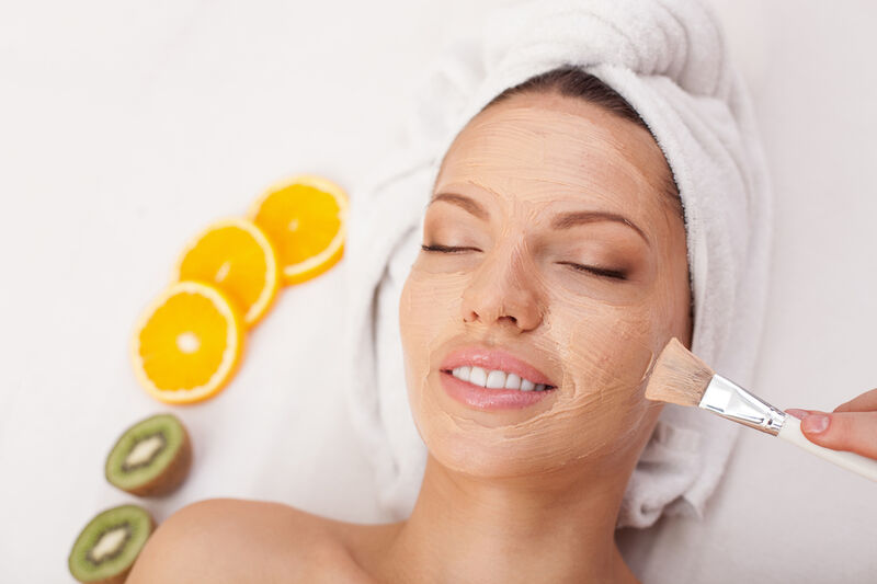 Woman at spa getting a peel